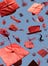 Picture of red graduation caps in the air on a blue backdrop
